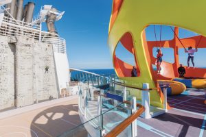 ID, Independence of the Seas, Sky Pad, trampoline, VR, jumping, fun, staff attendants, Rock Wall, climbing, ocean horizon in distance,