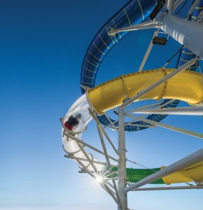 MA, Mariner of the Seas, ID, Independence of the Seas, Perfect Storm, Water Slides, Fun, Sliding, action, exterior shot of guest going down tube with water, star filter, sun rays,